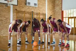 Basketball players taking a break on basketball court